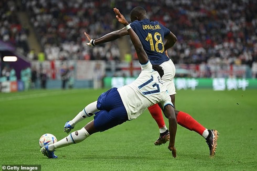 There were calls for a free-kick after Saka was fouled in the build-up to France's opener