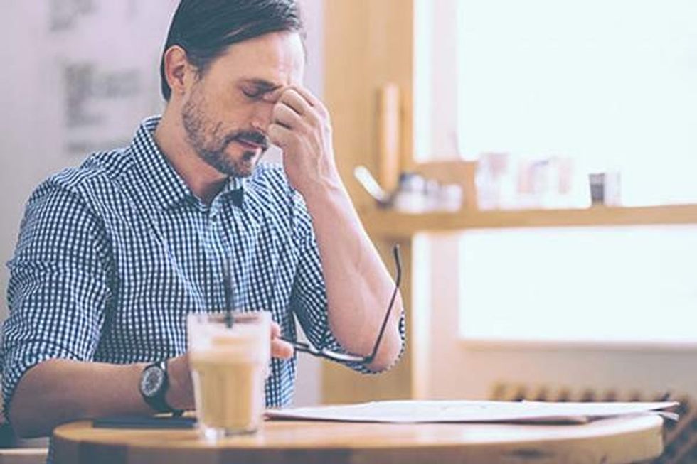 tired senior man sittin in the cafe 1