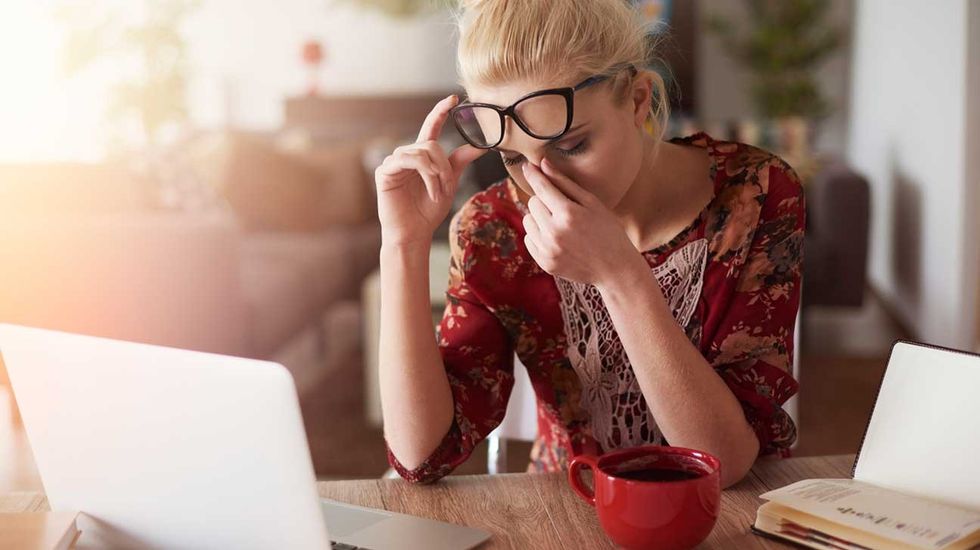 tired woman at desk