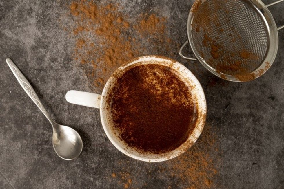 top view cup coffee with cocoa powder 23 2148251647