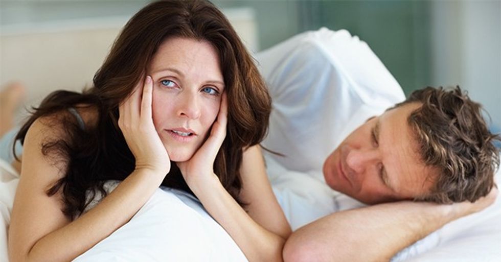 Unhappy female having problems in bed with husband