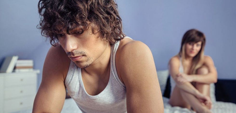 unhappy man couple in bed 1