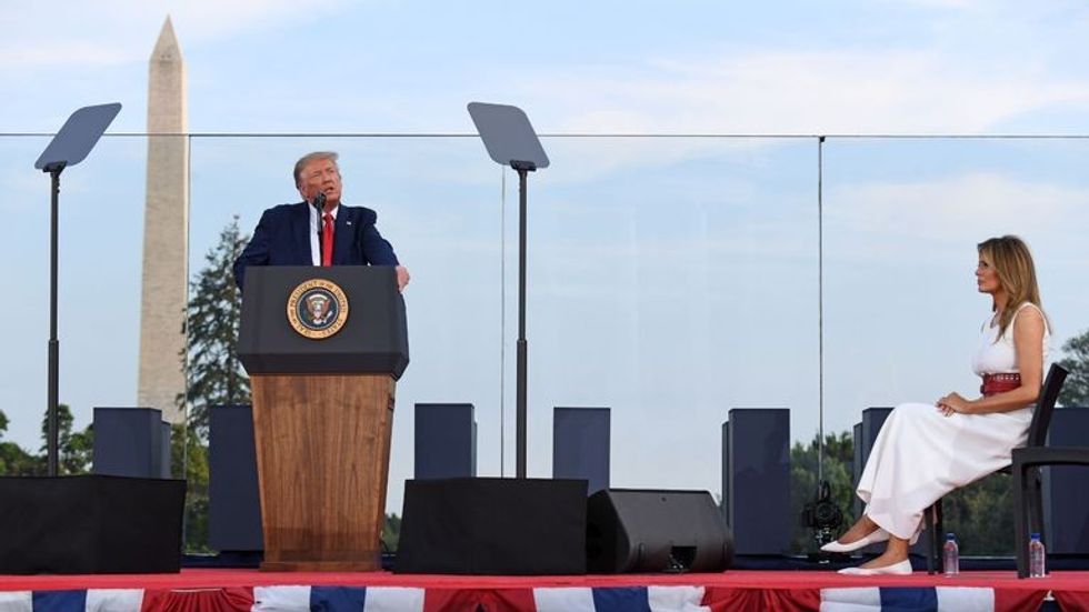 US President Donald Trump speaks as First Lady Melania Trump listens during the 2020