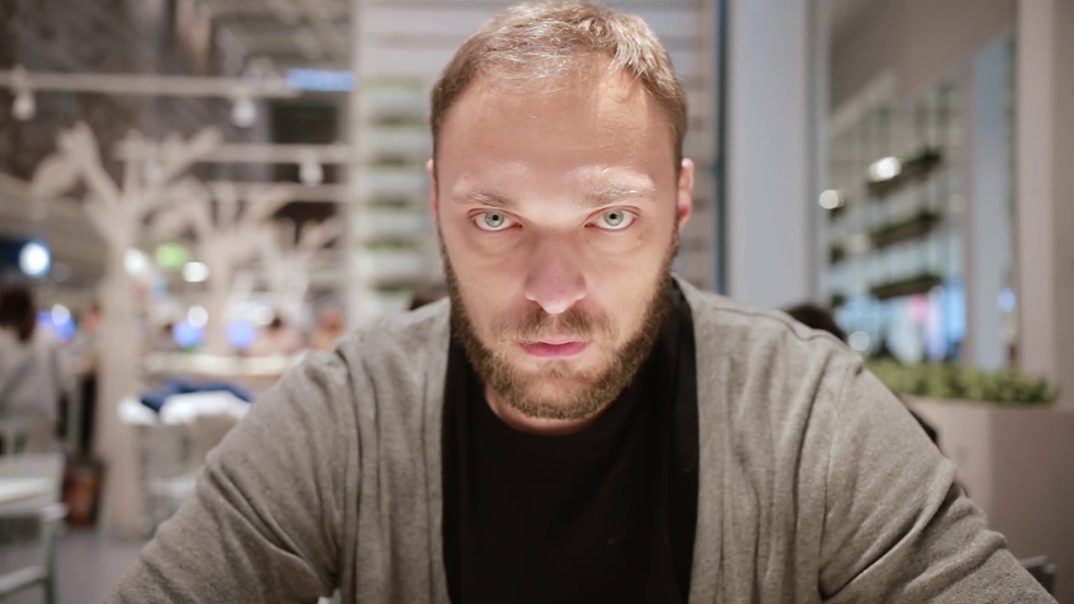 variety of emotions man with grey eyes and a beard is being very serious looking at the camera concentration b0e9