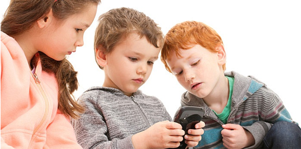 videoblocks little children playing game on mobile ph