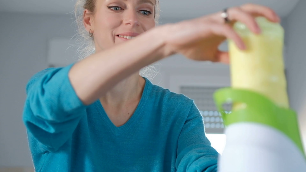 videoblocks vegetable juice raw food healthy eating woman with juicer juicing green vegetables and apple fruit as part of w