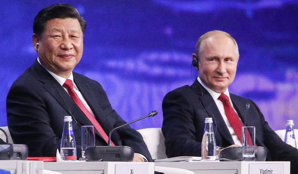 vladimir putin xi jinping e1616796545496
