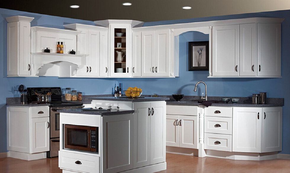 White kitchen cabinets and blue walls