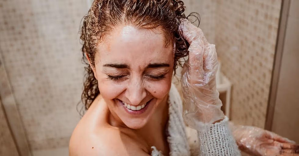 Woman applying hair treatment facebook 1