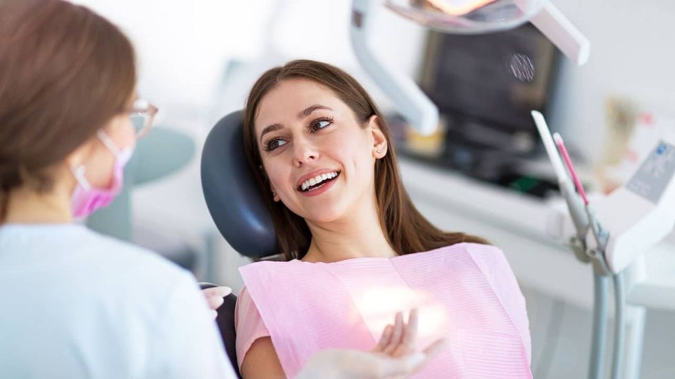 woman at dentist min