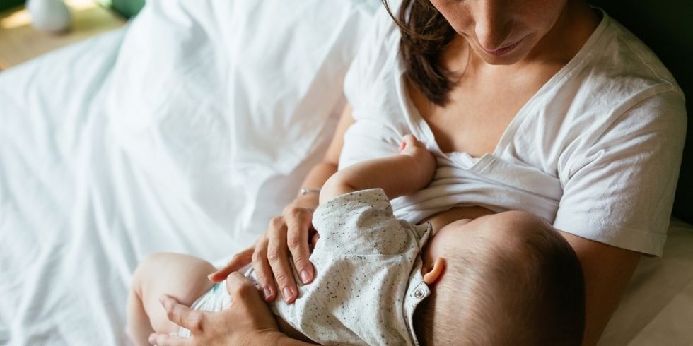 woman breastfeeding her baby