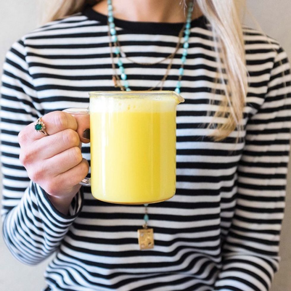 woman drinking golden milk 1