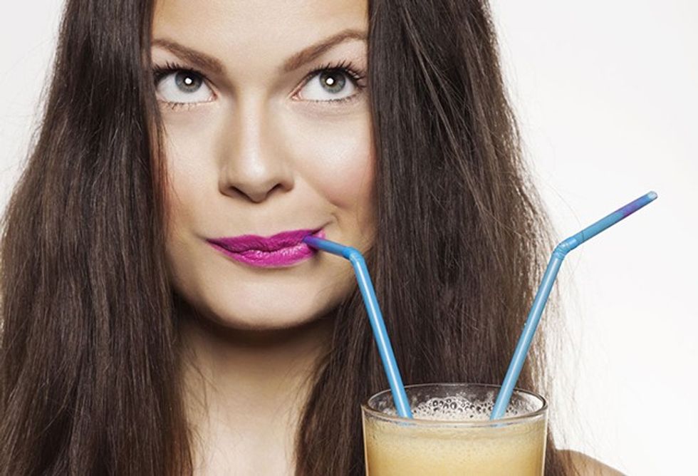 woman drinking smoothi