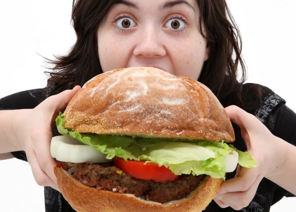 woman eating sandwich