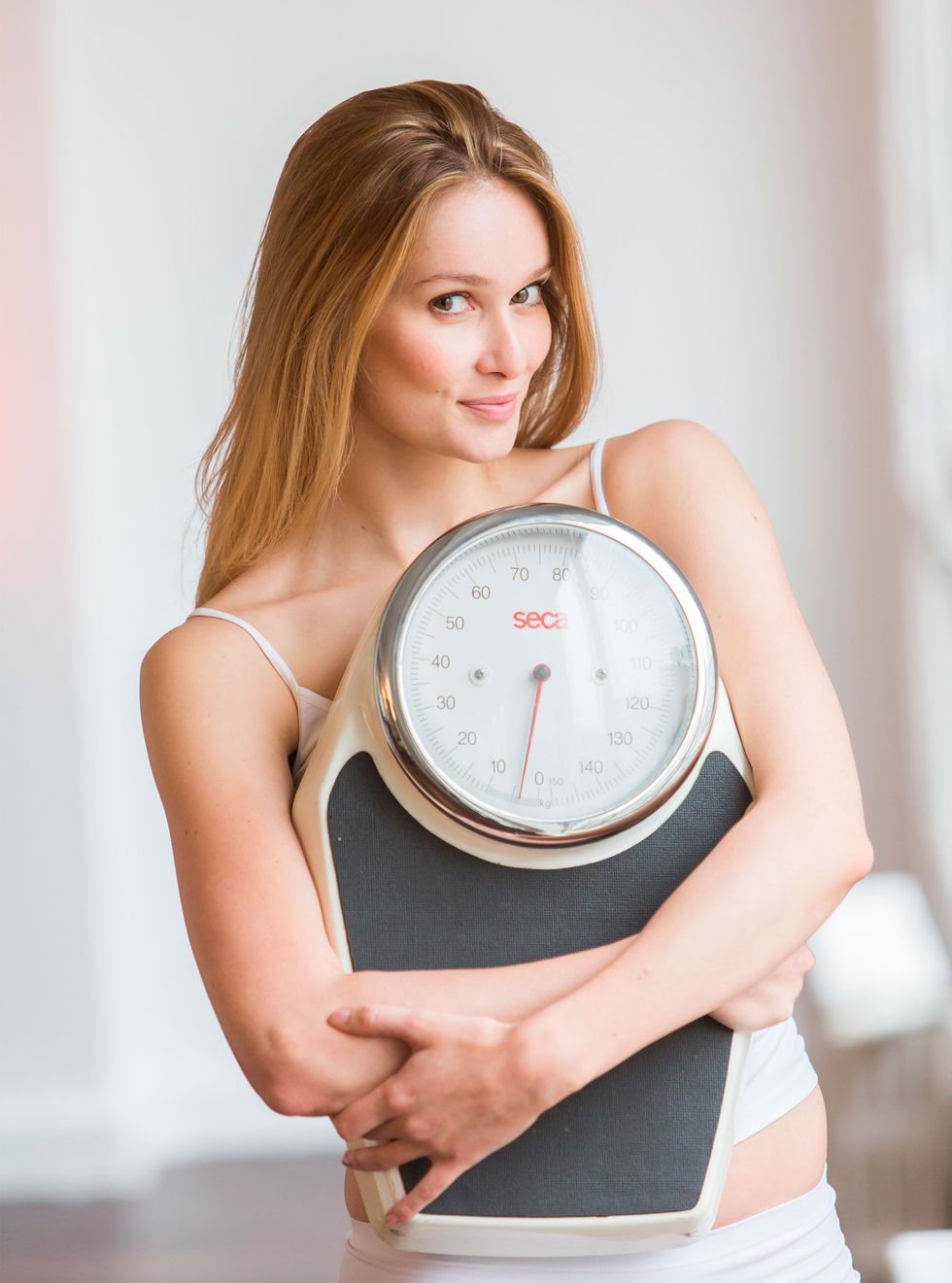 woman holding scales 1