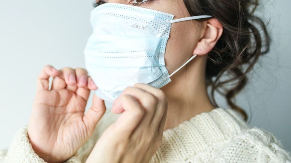 woman in white face mask 3873193 1