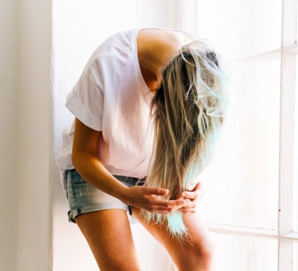 woman in white t shirt and blue denim short shorts 709864 1