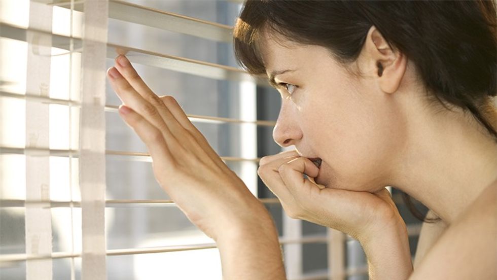 Woman looking out window