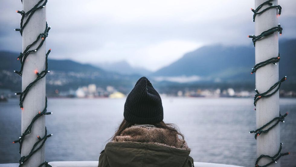woman looking over water