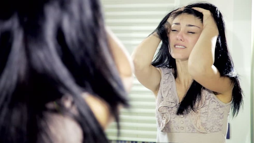 woman mirror unhappy 2 carousel