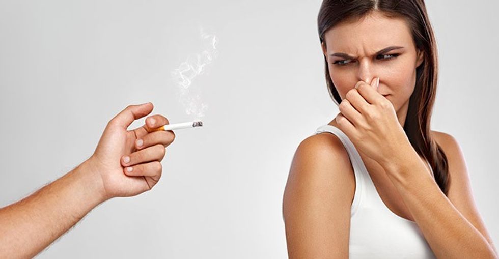 woman not enjoying smoking