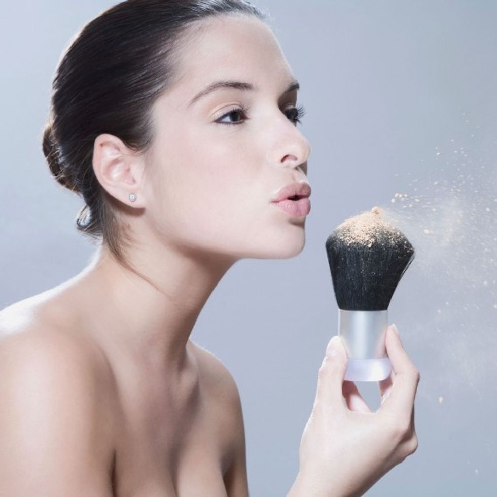 woman powder brush