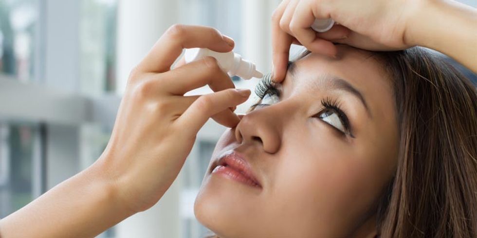 Woman putting in eye drops new spotlight size