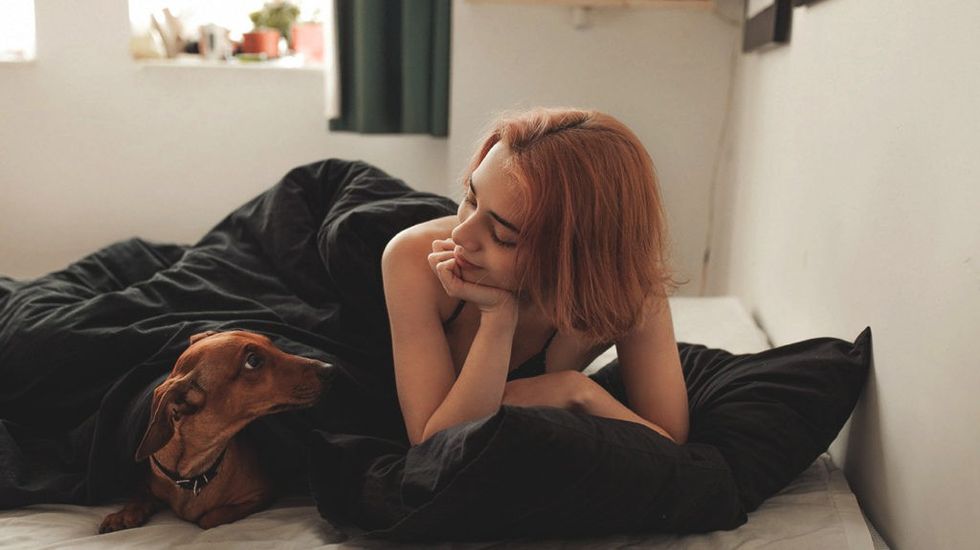 woman sleeping cat bed header.20180807203529605