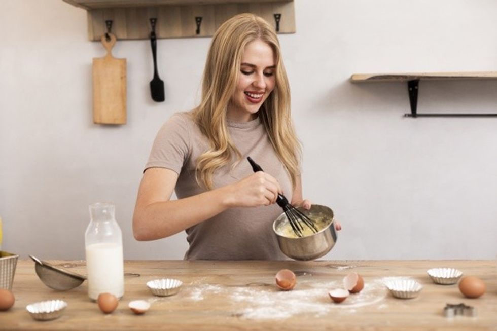 woman stir eggs milk metallic bowl 23 2148341764