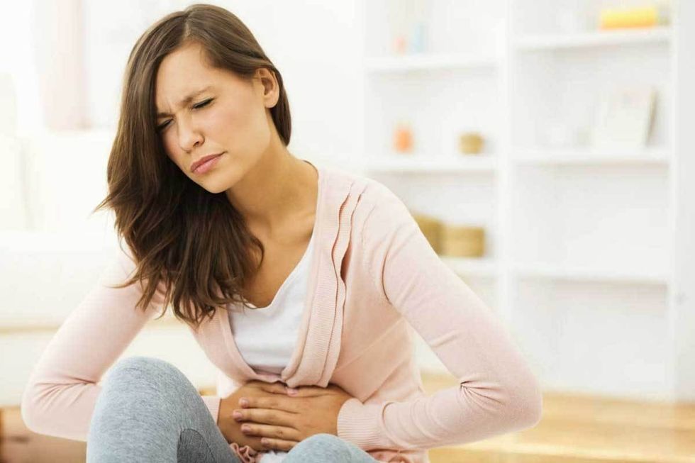 woman stomach pain cramps