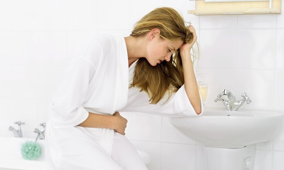 woman stomach pain uti health spry