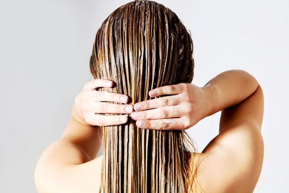 woman washing conditioning hair. q80 crop smart