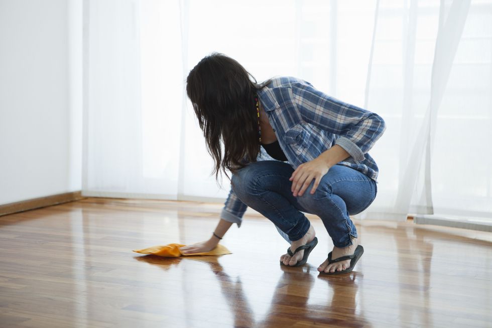 woman wiping hardwood floor 149285782 587573f73df78c17b6df10a5