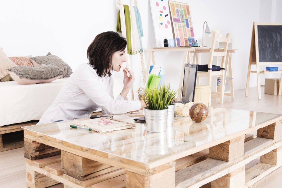 Woman working with her laptop in living room