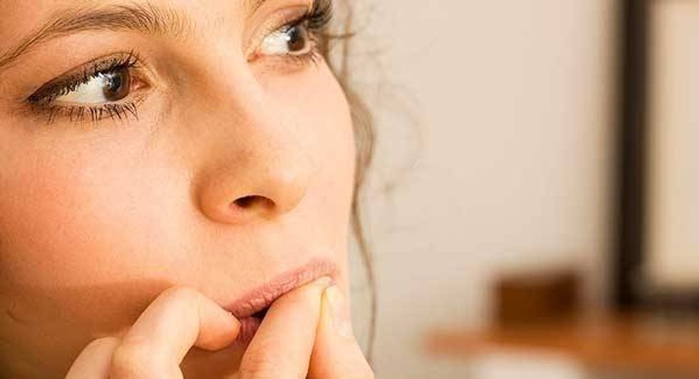 WomanBitingNails large