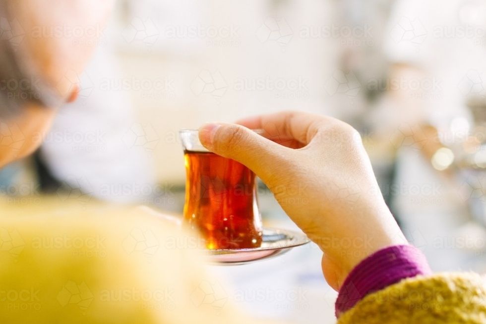 women drinking turkish tea at markets austockphoto 000027342