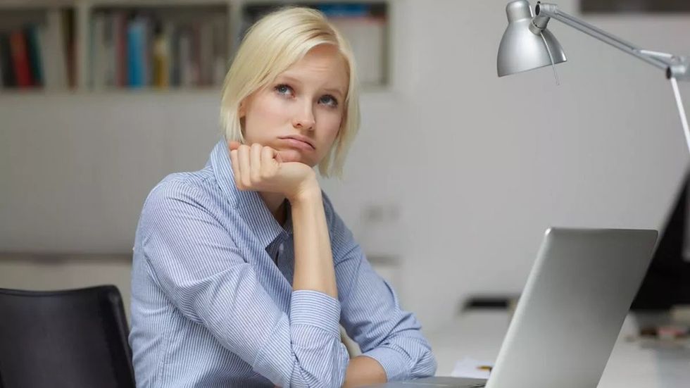Women in Office looking tired and fed up