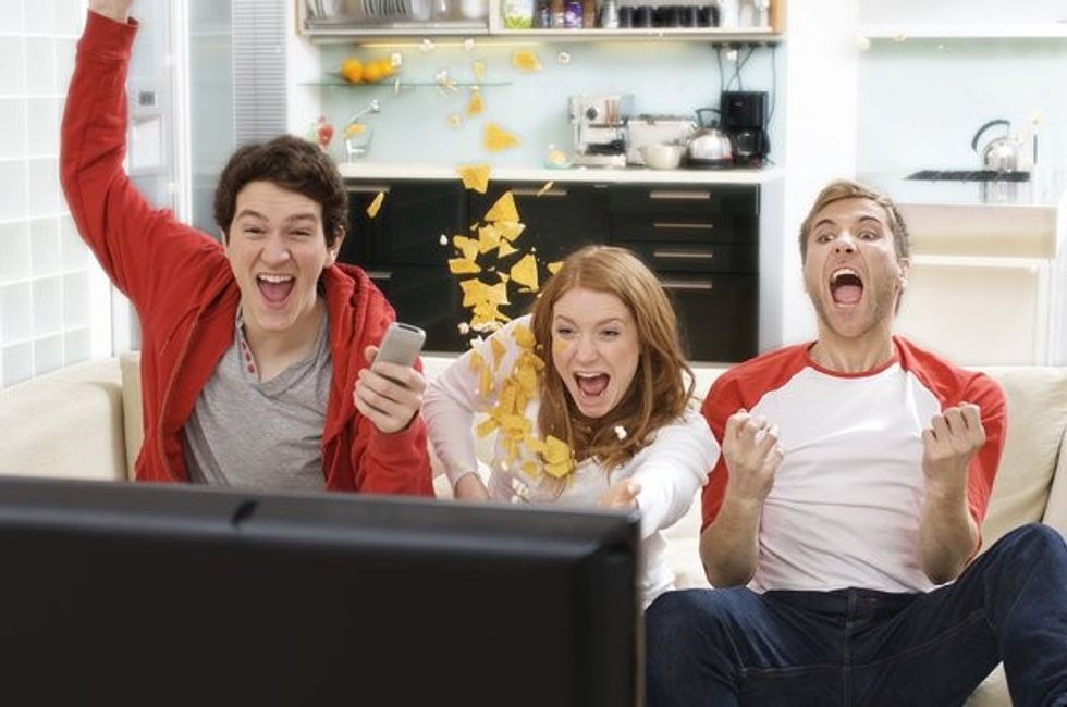 world cup football fans cheer at television sport