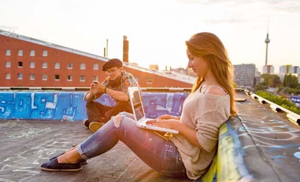 young couple having breakfast outdoors