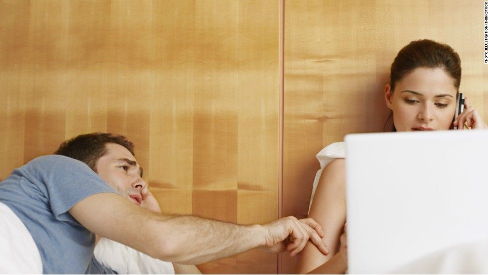 Young upset couple lying in a bed having problem