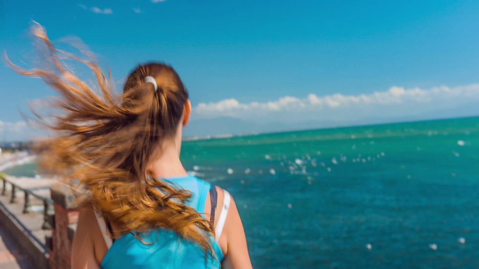 young woman running healthy jogging sea ocean vacation sea health living lifestyle athletic hair back fitness concept uhd 4k ex1i F0000