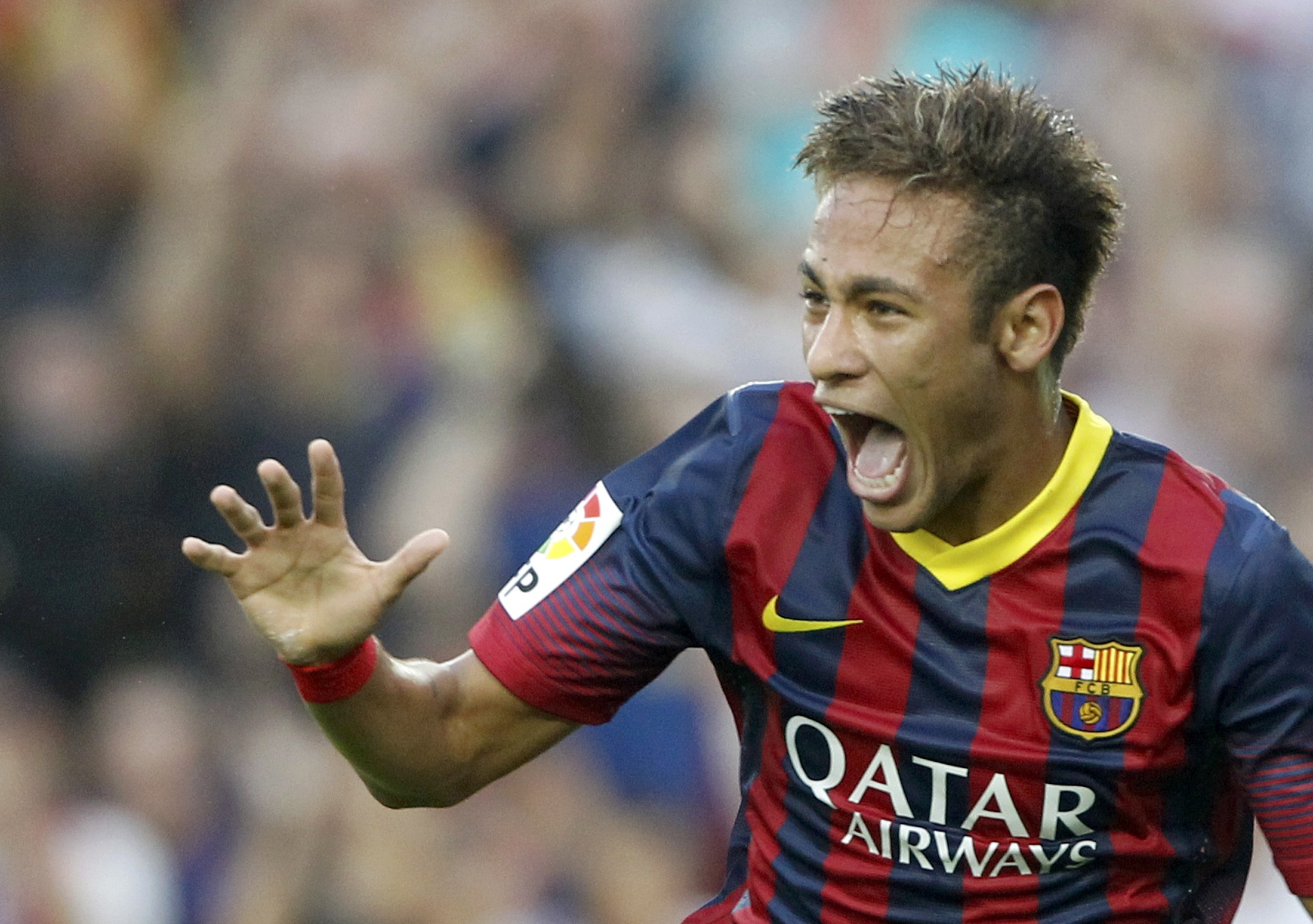 Barcelona's Neymar celebrates after scoring a goal against Real Madrid during their Spanish first division "Clasico" soccer match at Nou Camp stadium in Barcelona October 26, 2013. REUTERS/Albert Gea (SPAIN - Tags: SPORT SOCCER TPX IMAGES OF THE DAY)