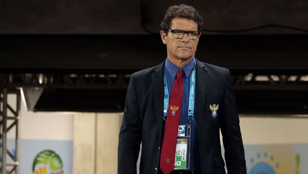 Russia's head coach Fabio Capello walks on to the pitch for the group H World Cup soccer match between Russia and South Korea at the Arena Pantanal in Cuiaba, Brazil, Tuesday, June 17, 2014. (AP Photo/Ivan Sekretarev)