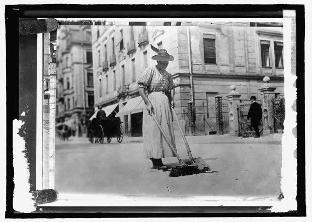 A woman street worker sweeps a street in Germany, circa 1909-1920, in this Library of Congress handout photo. For women 100 years ago, opportunities to work beyond the home and take part in political life were very limited. As the 20th century progressed, hard-won progress included gradually improved voting rights, while the upheaval of war pushed doors ajar as women worked as part of the war effort. U.S. Library of Congress archive photos show women's workplaces ranging from a flour mill in England to a coal mine in Belgium or Lincoln Motor Co.'s welding department in Detroit. International Women's Day is celebrated on March 8. REUTERS/National Photo Company Collection/Library of Congress/Handout via Reuters SEARCH "THE WIDER IMAGE" FOR ALL STORIES ATTENTION EDITORS - THIS PICTURE WAS PROVIDED BY A THIRD PARTY. REUTERS IS UNABLE TO INDEPENDENTLY VERIFY THE AUTHENTICITY, CONTENT, LOCATION OR DATE OF THIS IMAGE. THIS PICTURE IS DISTRIBUTED EXACTLY AS RECEIVED BY REUTERS, AS A SERVICE TO CLIENTS. FOR EDITORIAL USE ONLY. NOT FOR SALE FOR MARKETING OR ADVERTISING CAMPAIGNS.