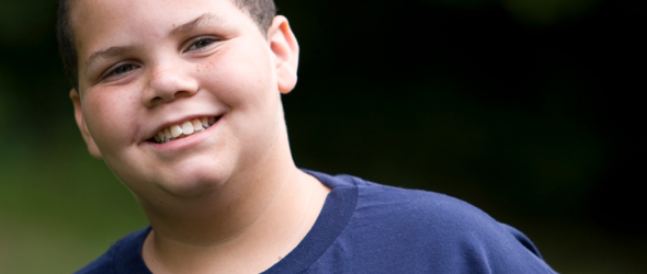 Portrait of a smiling boy outside