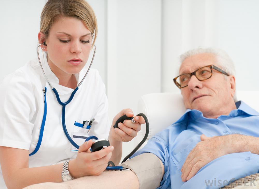 older-man-getting-blood-pressure-taken-by-young-doctor