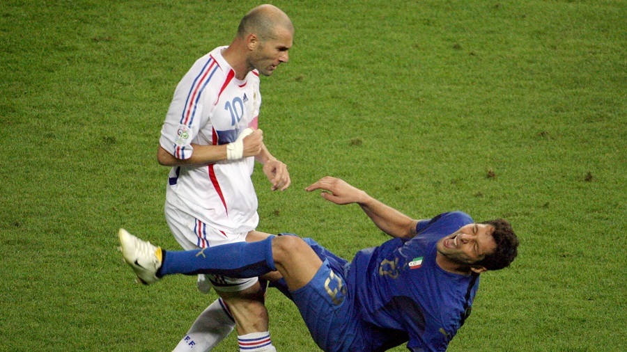 A photo taken 09 July 2006 shows French midfielder Zinedine Zidane (L) gesturing after head-butting Italian defender Marco Materazzi during the World Cup 2006 final football match between Italy and France at Berlin?s Olympic Stadium. AFP PHOTO JOHN MACDOUGALL (Photo credit should read JOHN MACDOUGALL/AFP/Getty Images)