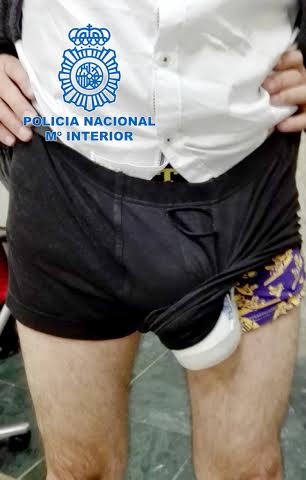 Pic shows: Hidden drugs in underwear.nnDubious Spanish airport police decided to body search on a man who had a suspiciously large bulge between his legs.nnThe 43-year-old man had just got off the plane from Costa Rica to the Madrid Barajas International Airport in the Spanish capital.nnPolice say they pulled him over in customs and checked his hand luggage, but found nothing. It was then that the officers attention was diverted to the abnormally large trouser bulge and decided to see what he was hiding underneath.nnTheir search revealed nearly half a kilo of cocaine wrapped in a plastic container and strapped to his genitals.nnThe official police page later tweeted an image with a humorous caption about the "suspicious package between his legs".nnThe images shows the rather large white tube poking out one side of a pair of black underpants, showing another floral pair of boxers underneath.nnLast night the not so ingenious drug smuggler appeared before a judge and was told he could face a prison sentence of up to three years if found guilty.nnMadrid airport police have to be constantly on the ball to catch traffickers who will use any way of getting drugs into the country.nnThey once arrested a 92-year-old woman in a wheelchair with four kilos of cocaine strapped to her body and hidden by layers of clothes.nnIn January 2014 airport police also found a pair of Portuguese travellers with 1.2 kilos of the class A drug hidden under their wigs.nnWeeks earlier a man was caught with a stash of cocaine hidden inside his artificial leg when he got off a flight from Panama.nn(ends)n