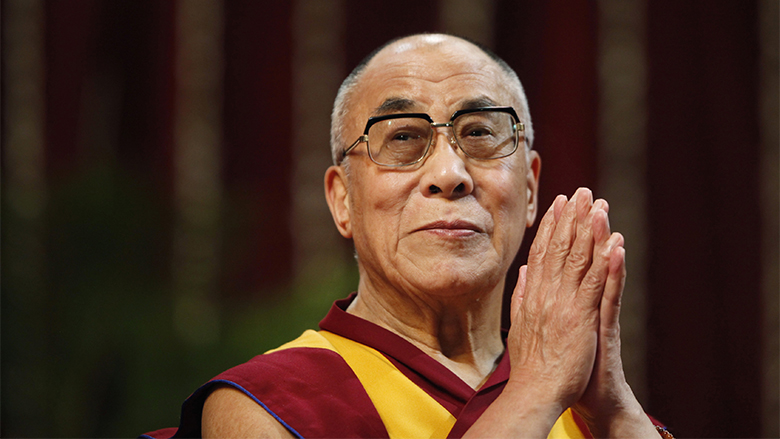 The Dalai Lama gestures before speaking to students during a talk at Mumbai University February 18, 2011. REUTERS/Danish Siddiqui (INDIA - Tags: EDUCATION RELIGION) - RTR2IRAI