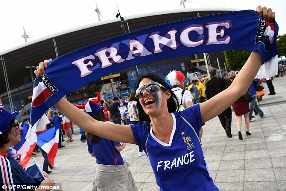 1465579020595_lc_galleryImage_A_France_supporter_poses_